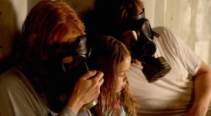 Take Shelter - family in bomb shelter with gas masks