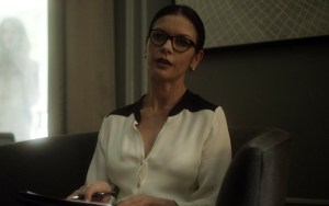 The beautilful and manipulative, Dr. Victoria Siebert (Catherine Zeta-Jones), unaware that someone is looking at her through the window.