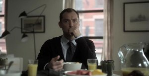 Dr. John Banks (Jude Law) chewing his breakfast, wondering how his world has turned upside down due to Emily's reaction to the drugs he prescribed her.