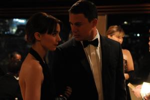 Martin (Channing Tatum) and Emily (Rooney Mara) looking like an aesthetically perfect couple, dressed smartly at a friend's party.