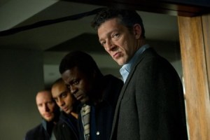Franck (Vincent Cassel), furtherst right, keeping a worryingly close eye on Simon's treatement, with his group of thugs alongside him to illustrate the consequences for Simon if he fails to shake off his amnesia.