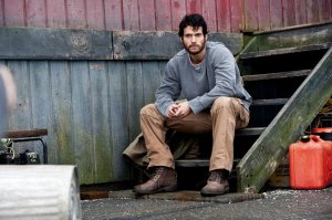 Clarke Kent (Henry Cavill) working as a blue-collar worker, unsure as to who he really is or where his life is taking him.