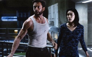 Logan/Wolverine (Hugh Jackman) running with Mariko (Tao Okamoto), trying to protect her from assassins working for... well that's anyone's guess.