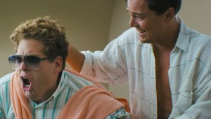 A drugged-up Belfort having some non-work related fun with his equally drugged-up friend and business partner, Donnie (Jonah Hill).