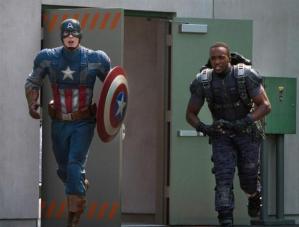 Steve Rogers/Captain America (Chris Evans), in full garb, ready to take out his (and America's) enemies, alongside the Falcon (Anthony Mackie).