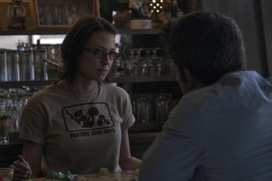 Nick going to the tavern to speak with his twin-sister, Margo (Carrie Coon), about how his relationship with Amy is almost non-existent.