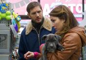 Bob with Nadia (Noomi Rapace), buying stuff for the pitbull puppy, Rocco.