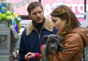 Bob with Nadia (Noomi Rapace), buying stuff for the pitbull puppy, Rocco.