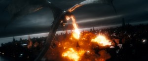 Smaug the Dragon (voiced thunderously by Benedict Cumberbatch) is our of the Lonely Mountain and torching Laketown.