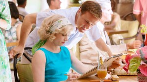 Walter (Christoph Waltz) standing over Margaret (Amy Adams) and admiring her work.