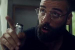 Nathan (Oscar Isaac, unrecognisable with a beard) talking with Caleb about the purpose of the experiment.