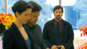 Gordo (Joel Edgerton) staring with unsettling intent at Simon and Robyn at the store.