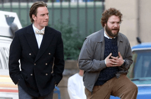 Young Steve Jobs (Michael Fassbender, left) talking through his business plans with his friend and co-founder, Steve 'Waz' Wazniak (Seth Rogen, right, playing decently and in a non-comedic role for a change).