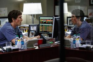 Dr Michael Burry (Christian Bale), in his office, listening to music whilst working out that the US property market would collapse in 2007.