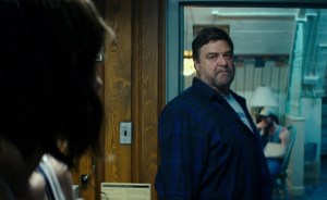 Howard (John Goodman) staring at Michelle, warning her not to go into his room or to push her luck.