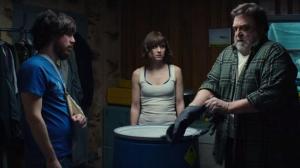 Howard believes that there is a traitor among them, so brings out some highly corrosive substance to tacitly threaten Michelle and another captive, Emmett (John Gallagher Jr).