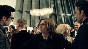 The villainous Lex Luthor (Jesse Eisenberg), getting in away of a first and tense encounter between Clarke Kent (Henry Cavill) and Bruce Wayne (Ben Affleck).