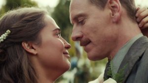 The happy couple, Isabel (Alicia Vikander) and Tom (Michael Fassbender), dancing at their wedding. This photo may be genuine show of affection from the two actors since they are a couple in real life as a result of this film.